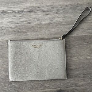 Kate Spade New w/o tags gray zipped up Wristlet Clutch with silver hardware